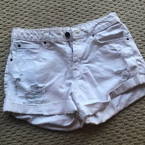 White ripped denim shorts